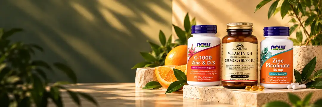 Вітаміни C, D3 та цинк NOW Foods і Solgar з апельсинами